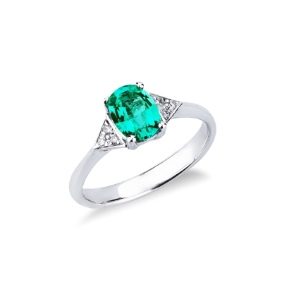 White gold 18k ring with emerald and three diamonds on each side 