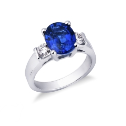 18k white gold ring with a central blue sapphire and lateral diamonds 