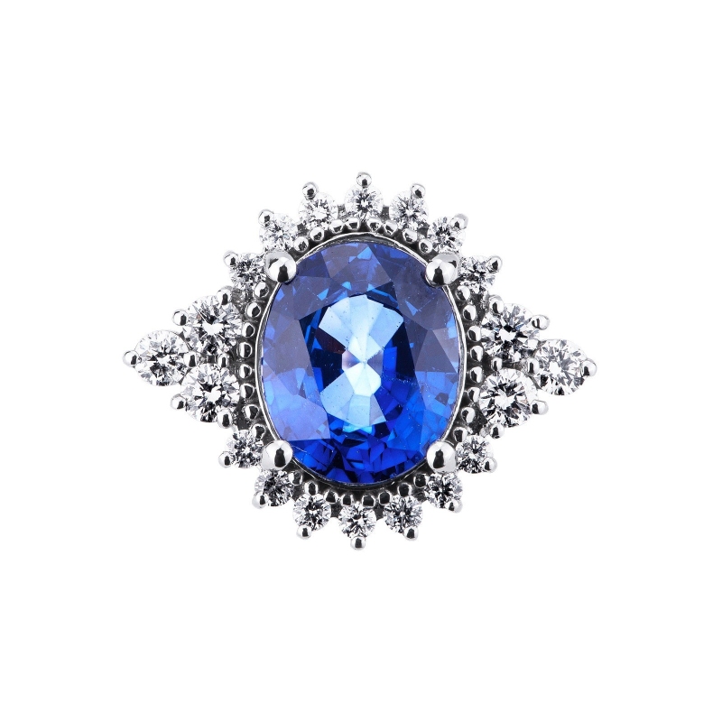 White gold 18k ring with diamonds and an oval cut blue sapphire