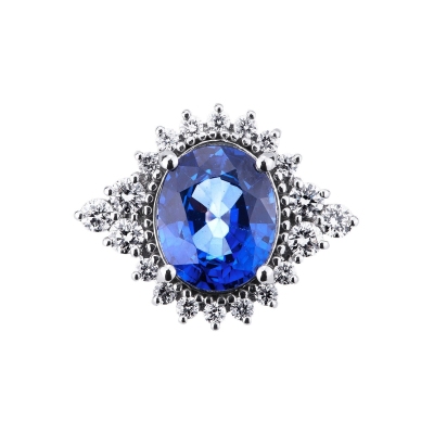 White gold 18k ring with diamonds and an oval cut blue sapphire