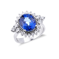 White gold 18k ring with diamonds and an oval cut blue sapphire