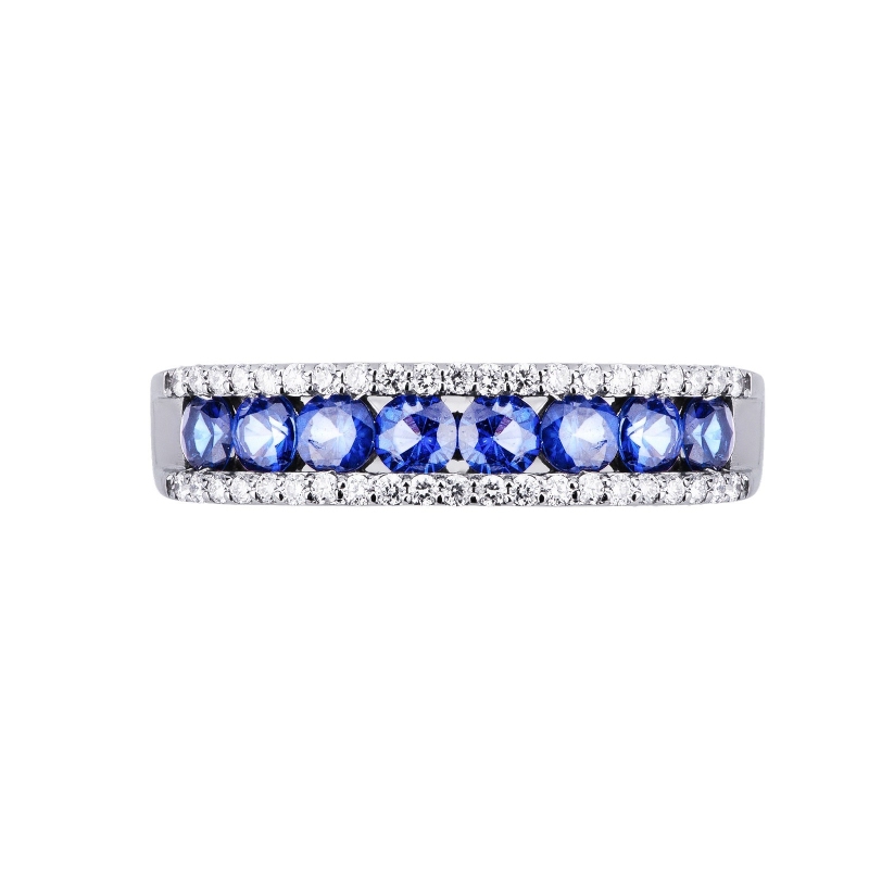 18k white gold ring with a central row of blue sapphires and diamonds 
