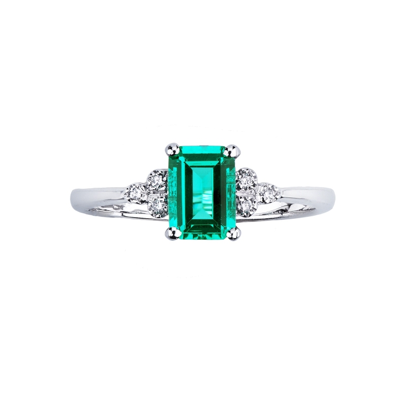 White gold 18k ring with an emerald and three bezel diamonds 
