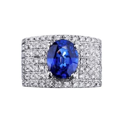 Band ring with a central blue sapphire oval cut and diamonds