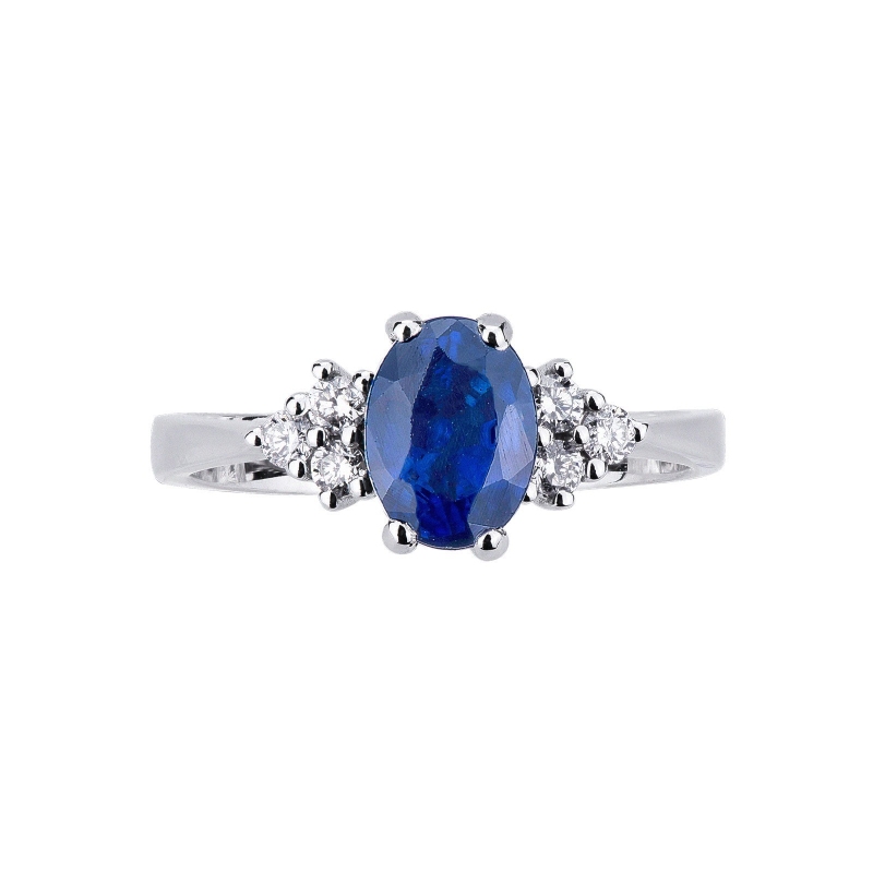 White gold 18k ring with lateral diamonds and blue sapphire 