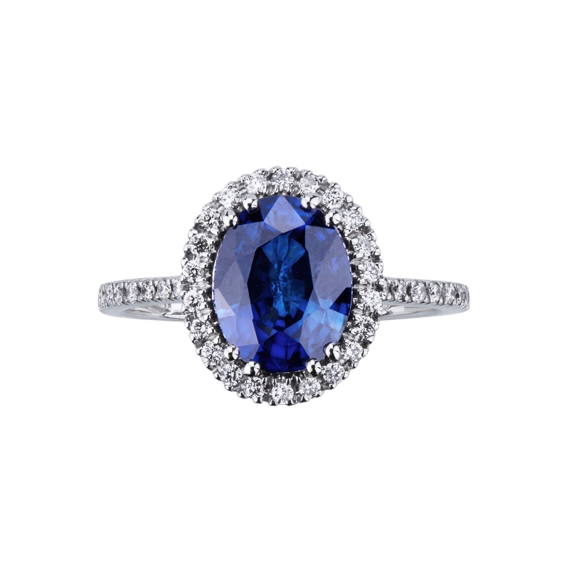 18k white gold halo ring with blue oval sapphire and diamond shoulder set 