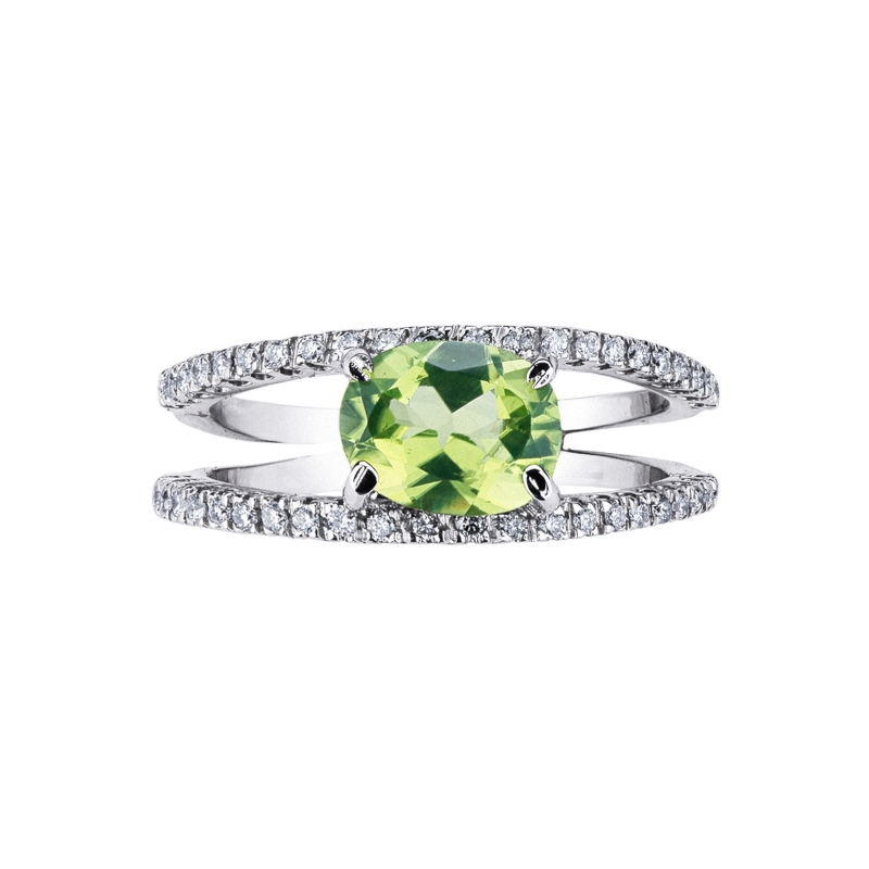 18k white gold ring with central peridot and double diamond rows