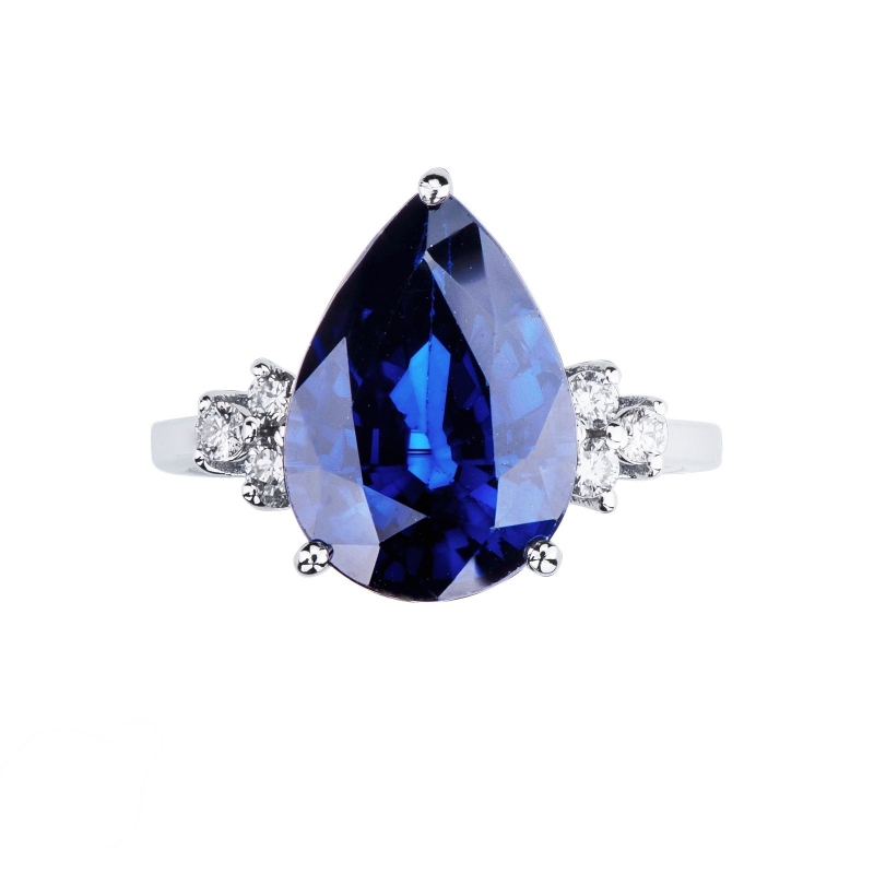 Ring in white gold 18k with central blue sapphire drop cut and three diamonds per side