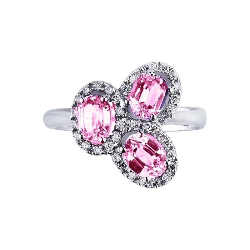18k white gold halo ring with diamonds and three oval cut pink sapphires