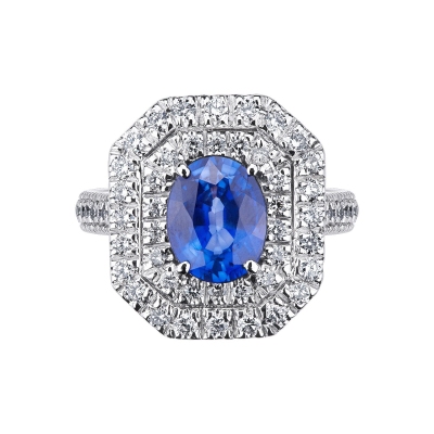 Halo ring with a central blue sapphire and diamonds white gold 18k