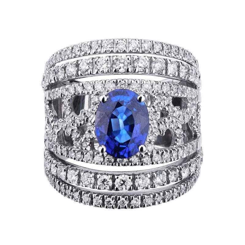 White gold 18k band ring with a central blue sapphire and diamonds 