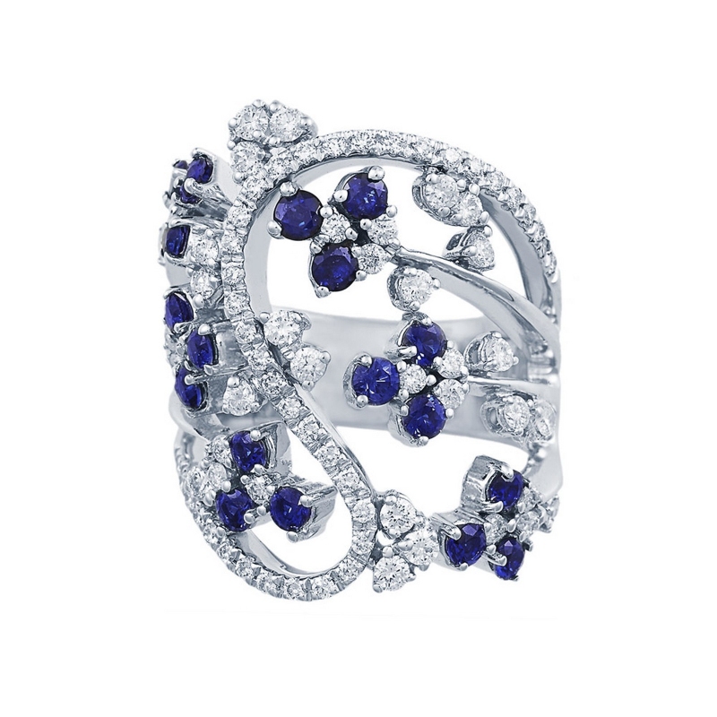 18k white gold ring with flowers of blue sapphires and diamonds