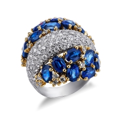 Bicolor ring with blue sapphires pear cut and diamonds 