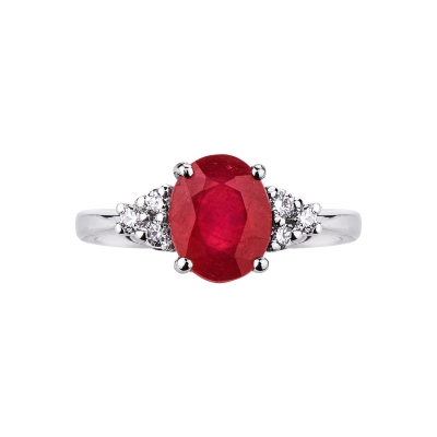 White gold 18k ring with a central ruby and three diamonds per side 