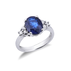 White gold 18k ring with a central blue sapphire and diamonds 