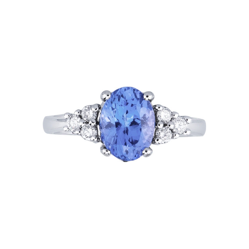 18k White gold ring with central tanzanite oval cut and three diamonds per side