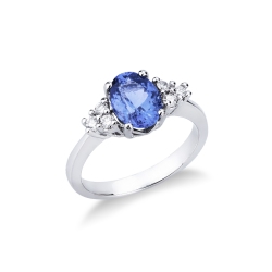 18k White gold ring with central tanzanite oval cut and three diamonds per side