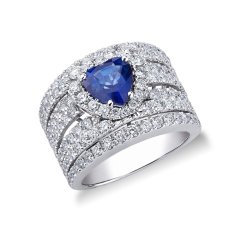 White gold 18k ring with a blue sapphire heart cut and diamonds 