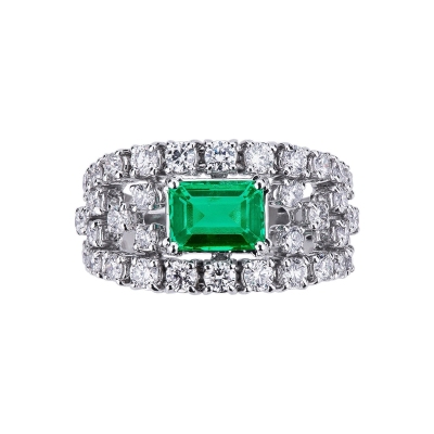 18k white gold ring with a central emerald and diamonds 