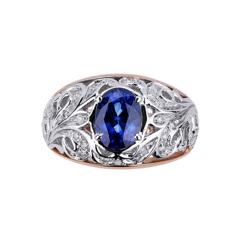 18k white and rosé gold with a central blue sapphire and diamonds 