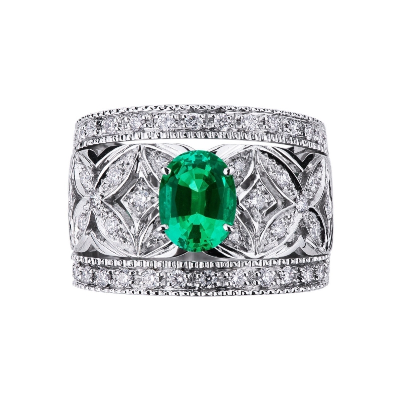 18k white gold band ring with diamonds and a central emerald
