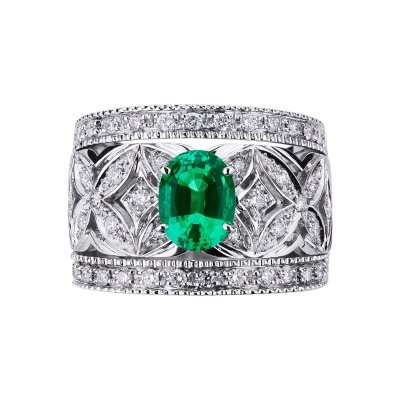 18k white gold band ring with diamonds and a central emerald