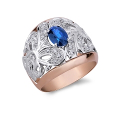 18k white and rosé gold ring with a central blue sapphire and diamonds 