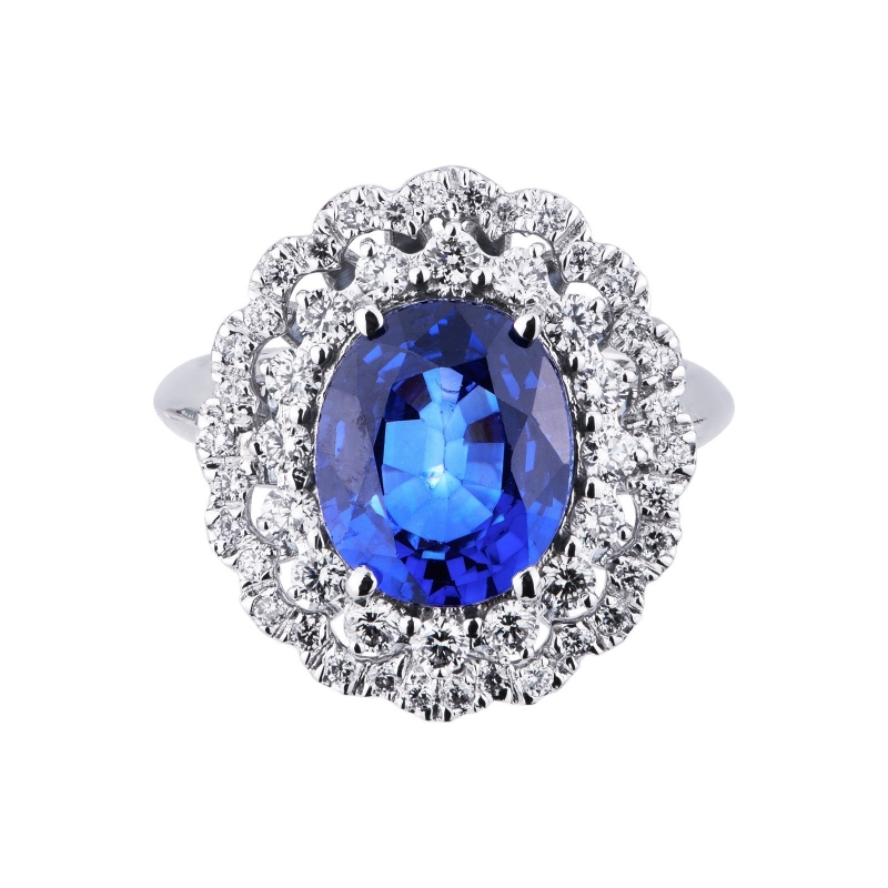 Halo ring with a central blue sapphire and diamonds white gold 18k