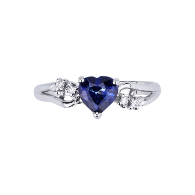 White gold 18k ring with diamonds and a heart cut blue sapphire