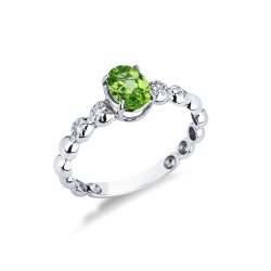 Anello in oro bianco 18k con peridoto e 2 diamanti per lato
