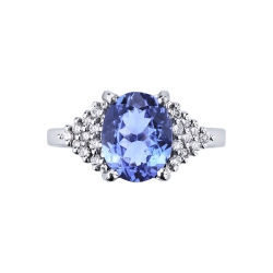 18k white gold ring with central oval tanzanite and lateral diamond paves 2
