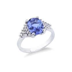 18k white gold ring with central oval tanzanite and lateral diamond paves