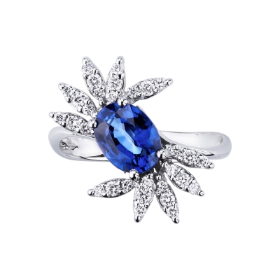 White gold 18k ring with a blue sapphire oval cut and diamonds petals  