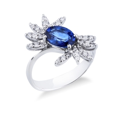 White gold 18k ring with a blue sapphire oval cut and diamonds petals  