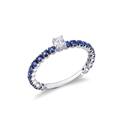 White gold 18k half eternity ring with blue sapphire and central diamond