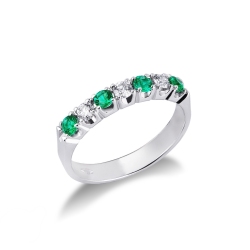 White gold 18k half eternity ring with three diamonds and four emeralds