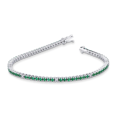 Wire style tennis bracelet with emeralds and diamonds