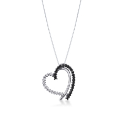 Heart shape pendant with black and white diamonds