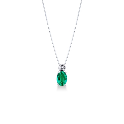 Solitaire emerald pendant with round cut diamond