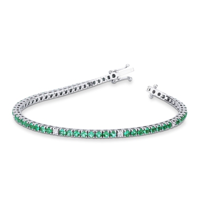 Square links tennis bracelet with emeralds and round cut diamonds