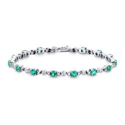 Alternate bracelet with emeralds and round cut diamonds
