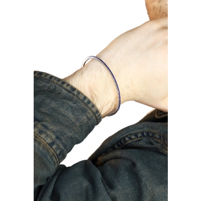 Bracciale rigido tennis con zaffiri blu in oro bianco 18k