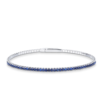 Bracciale rigido tennis con zaffiri blu in oro bianco 18k