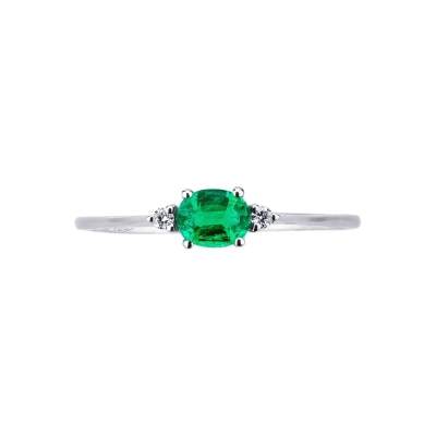 White gold 18k ring with a central emerald and lateral diamonds