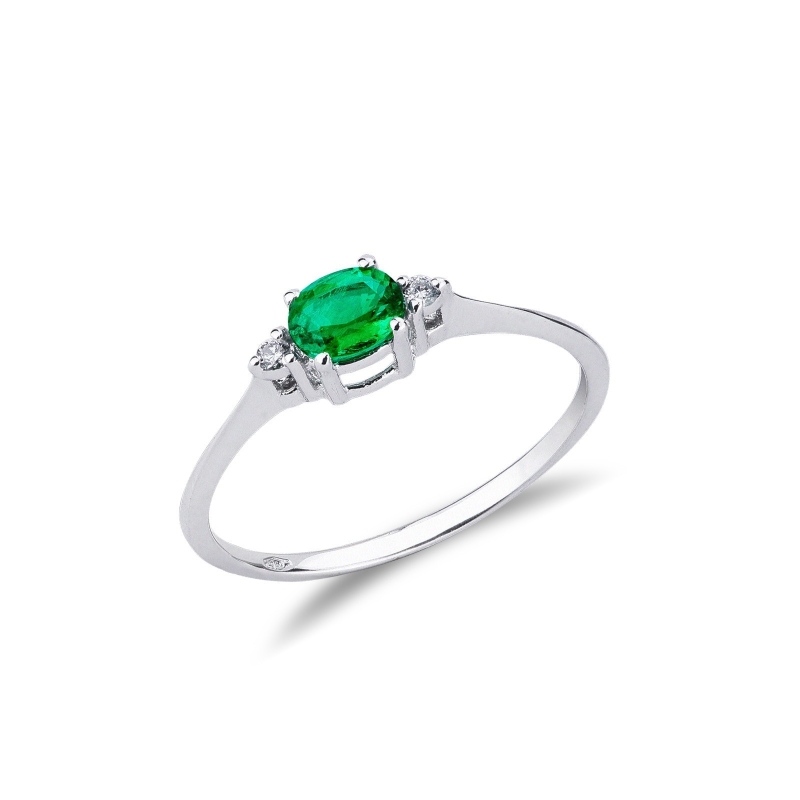 White gold 18k ring with a central emerald and lateral diamonds