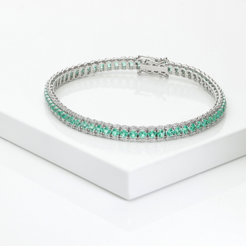 BRACCIALE TIPO TENNIS A 3 FILE CON BRILLANTI E SMERALDI. LARGH.5.00MM 