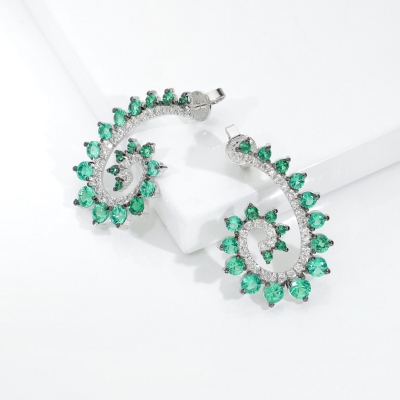 ORECCHINI A SPIRALE CON BRILLANTI E SMERALDI