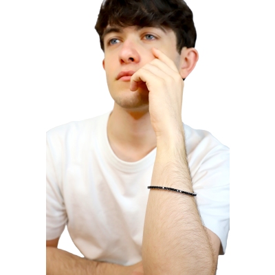 Bracciale tennis elastico con diamanti neri in oro bianco 18k