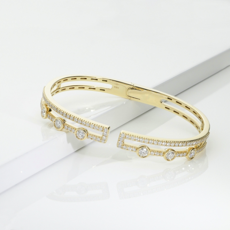 Bracciale semirigido in oro giallo 18k con diamanti