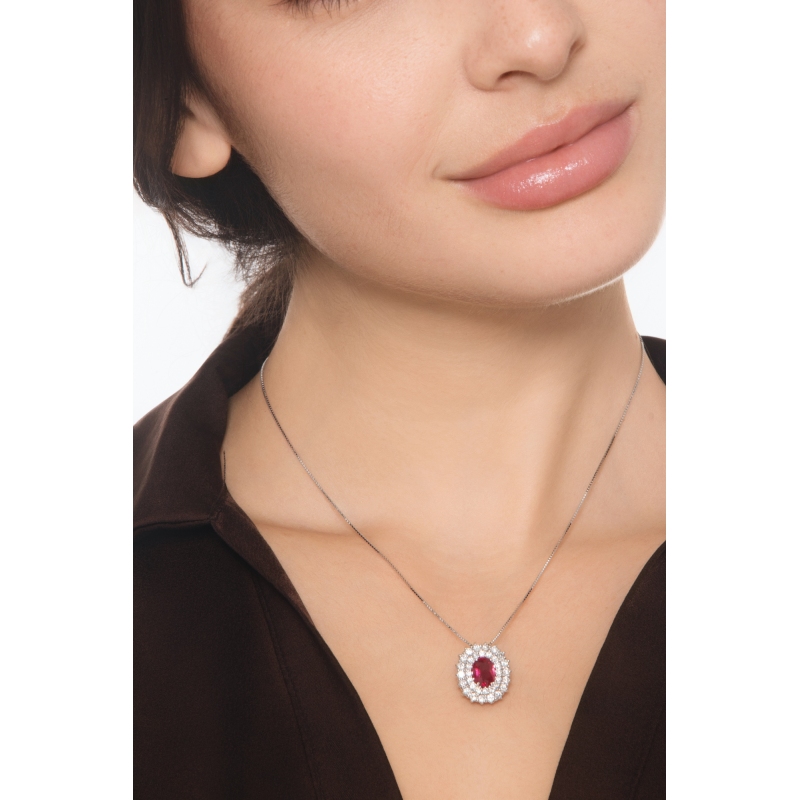 Double halo neacklace in white gold 18k with central ruby oval cut and diamonds 